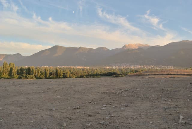 Looking across Colosae tel towards some beautiful mountains at sunset.