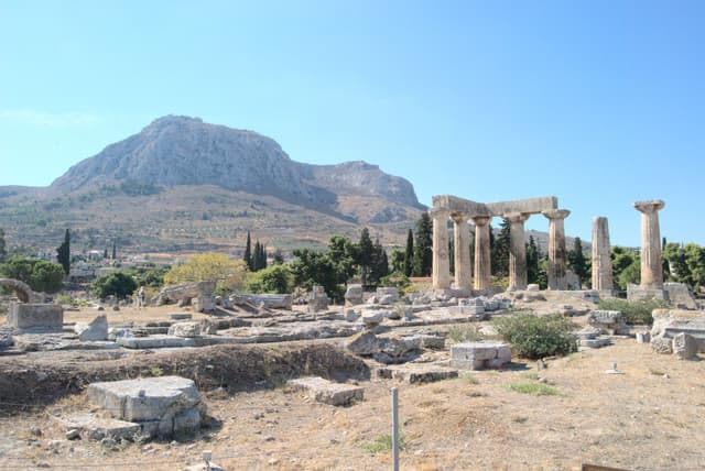 Looking towards the mountaintop Acrocorinth with the temple of the Apollo in the foreground.